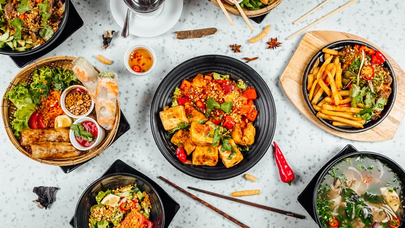 Freshly prepared Chinese dumplings served with soy sauce, a popular menu option at Curry Gourmet.