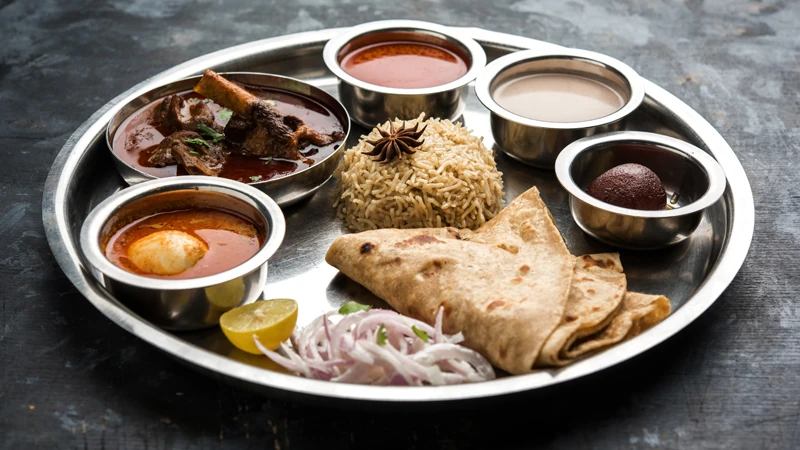 Indo-French fusion Indian set meal served with authentic curries.