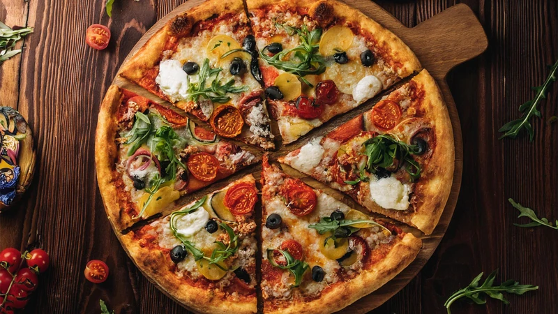 Thin-crust pizza topped with gourmet Indian-inspired ingredients from Curry Gourmet.